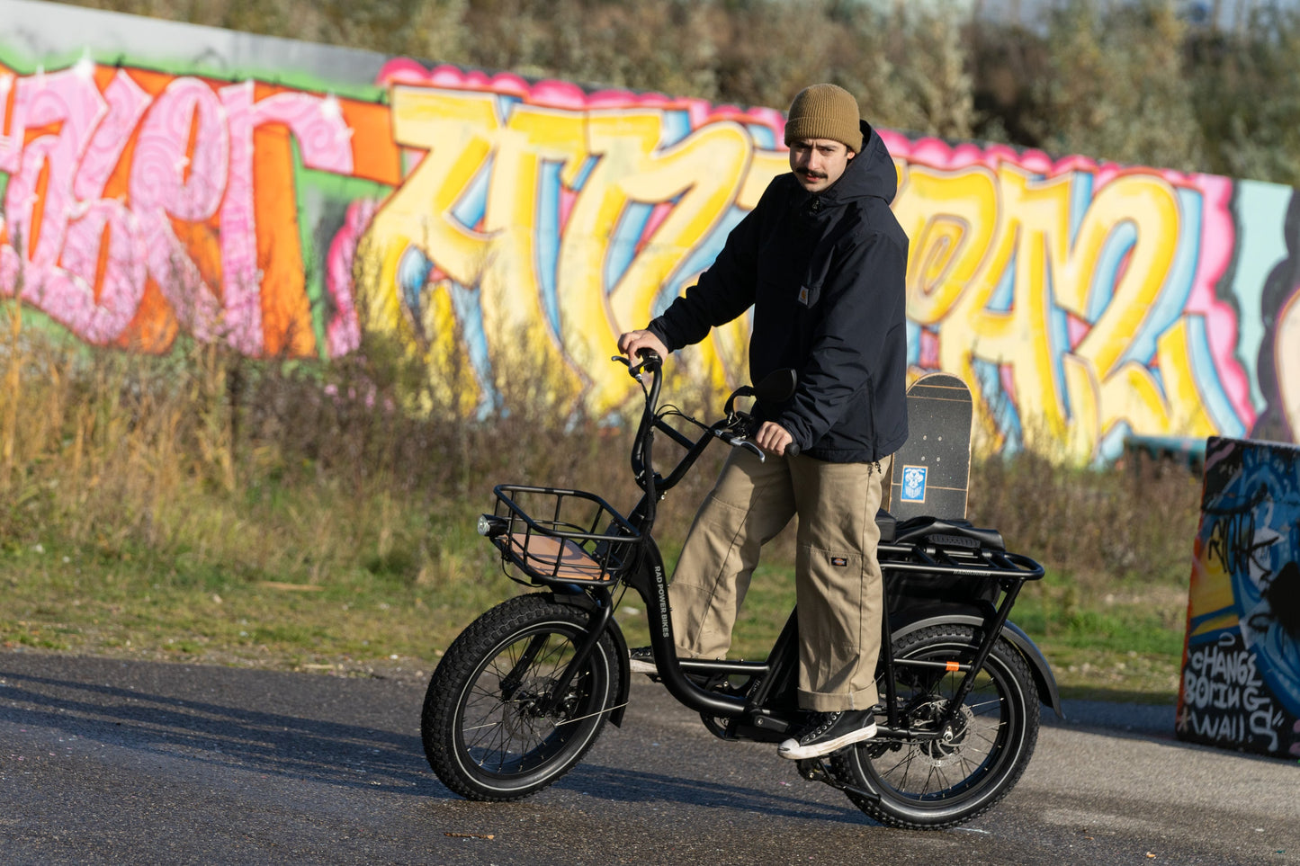 man riding on a black RadRunner Electric Utility Bike
