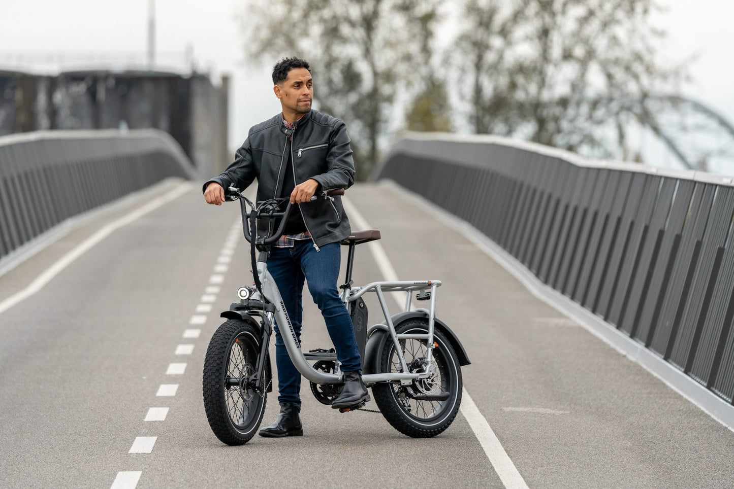 Man riding a silver RadRunner Plus Electric Utility Bike