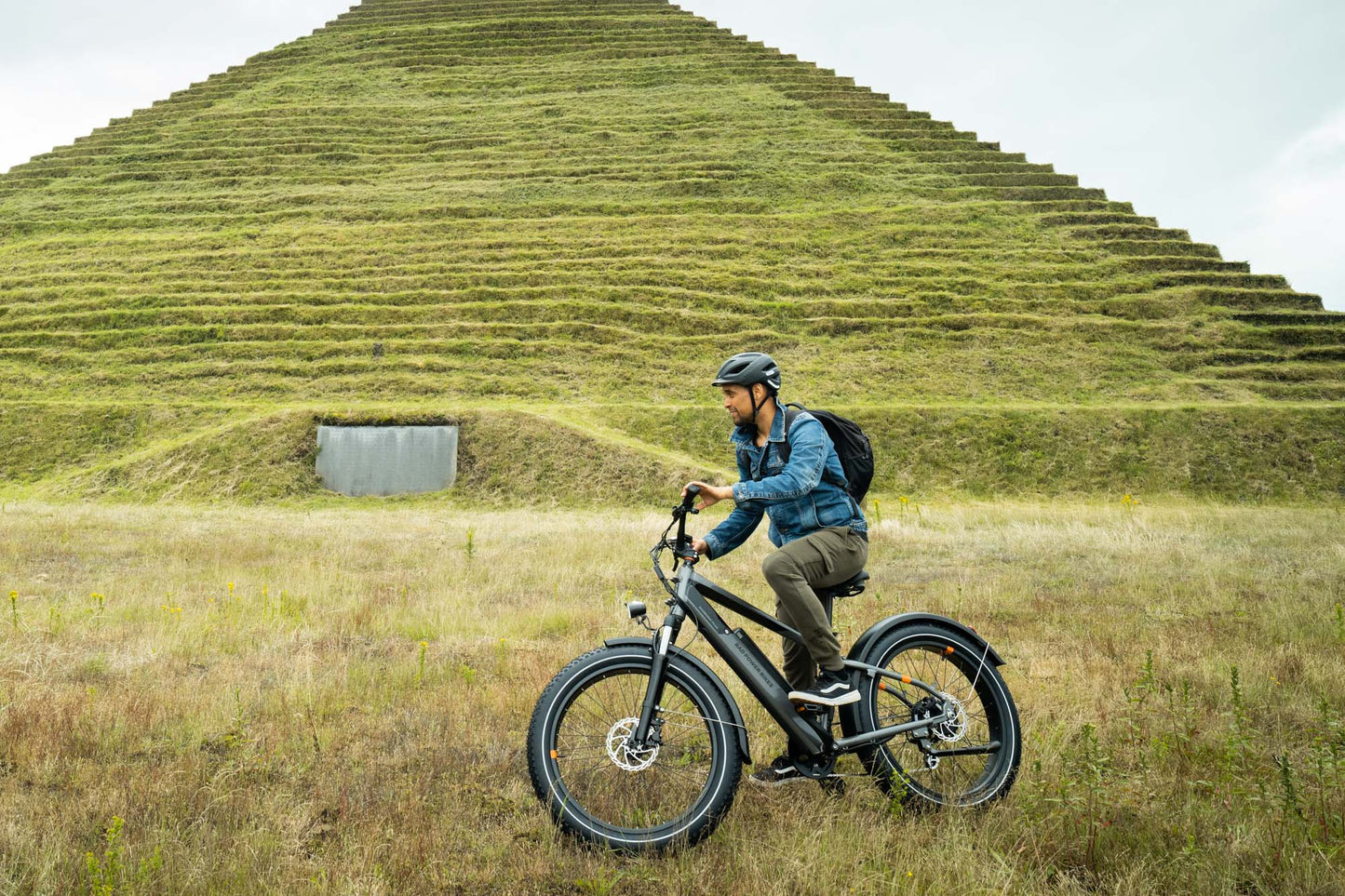 Male riding a black RadRhino 6 Plus Electric Bike