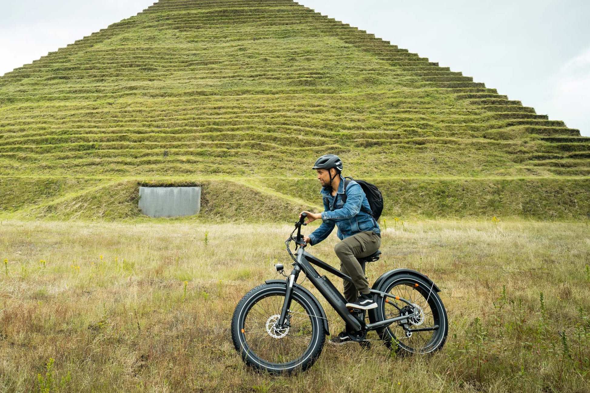 Male riding a black RadRhino 6 Plus Electric Bike